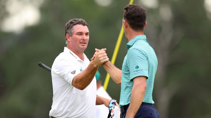 Ryan Fox shakes hands with playing partner Billy Horschel on the 18th green after their first round at the 2023 Masters Tournament at Augusta National Golf Club. Photo / Getty