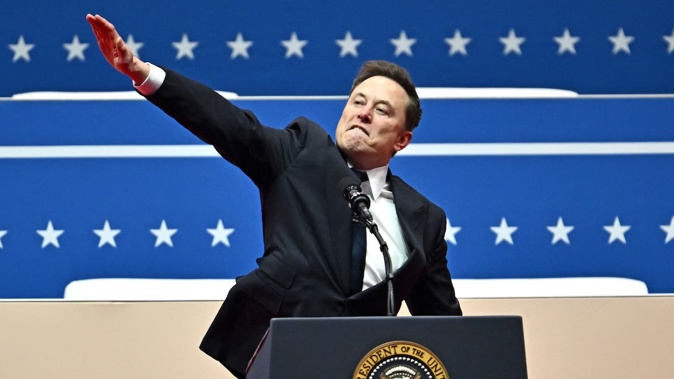 Tesla and SpaceX CEO Elon Musk performs what looks like a Nazi salute as he speaks during the inaugural parade inside Capitol One Arena, in Washington, DC, on January 20, 2025. Photo/AFP