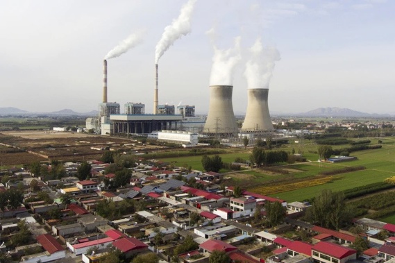 Guohua Power Station, a coal-fired power plant, operates in Dingzhou, Baoding, in the northern China’s Hebei province, Friday, Nov. 10, 2023. (AP Photo/Ng Han Guan)