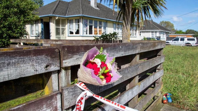 Flowers have been left at the scene of the shooting in Feilding. Photo / Mark Mitchell