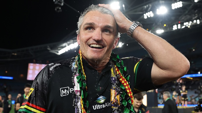 Ivan Cleary, coach of the Panthers reacts after having water thrown over him in celebration after winning the 2024 NRL Grand Final match between the Melbourne Storm and the Penrith Panthers at Accor Stadium on October 06, 2024, in Sydney, Australia. (Photo by Cameron Spencer/Getty Images)