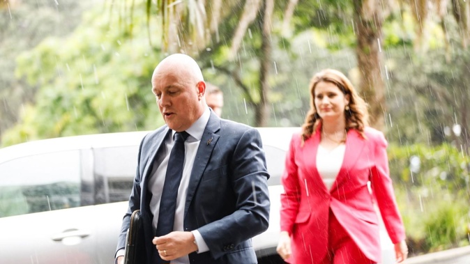 National's Nicola Willis and Christopher Luxon have not let the Auckland rain cast a dampener on coalition talks. Photo / Michael Craig