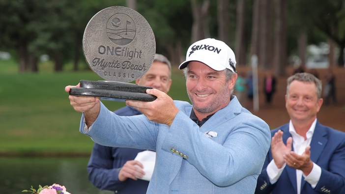 Ryan Fox of New Zealand celebrates with the trophy after winning the Myrtle Beach Classic in a playoff. Photo / AFP