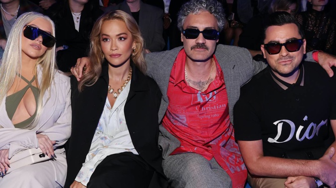 Christina Aguilera, Rita Ora, Taika Waititi, and Daniel Levy enjoy the Dior fashion show in Los Angeles.