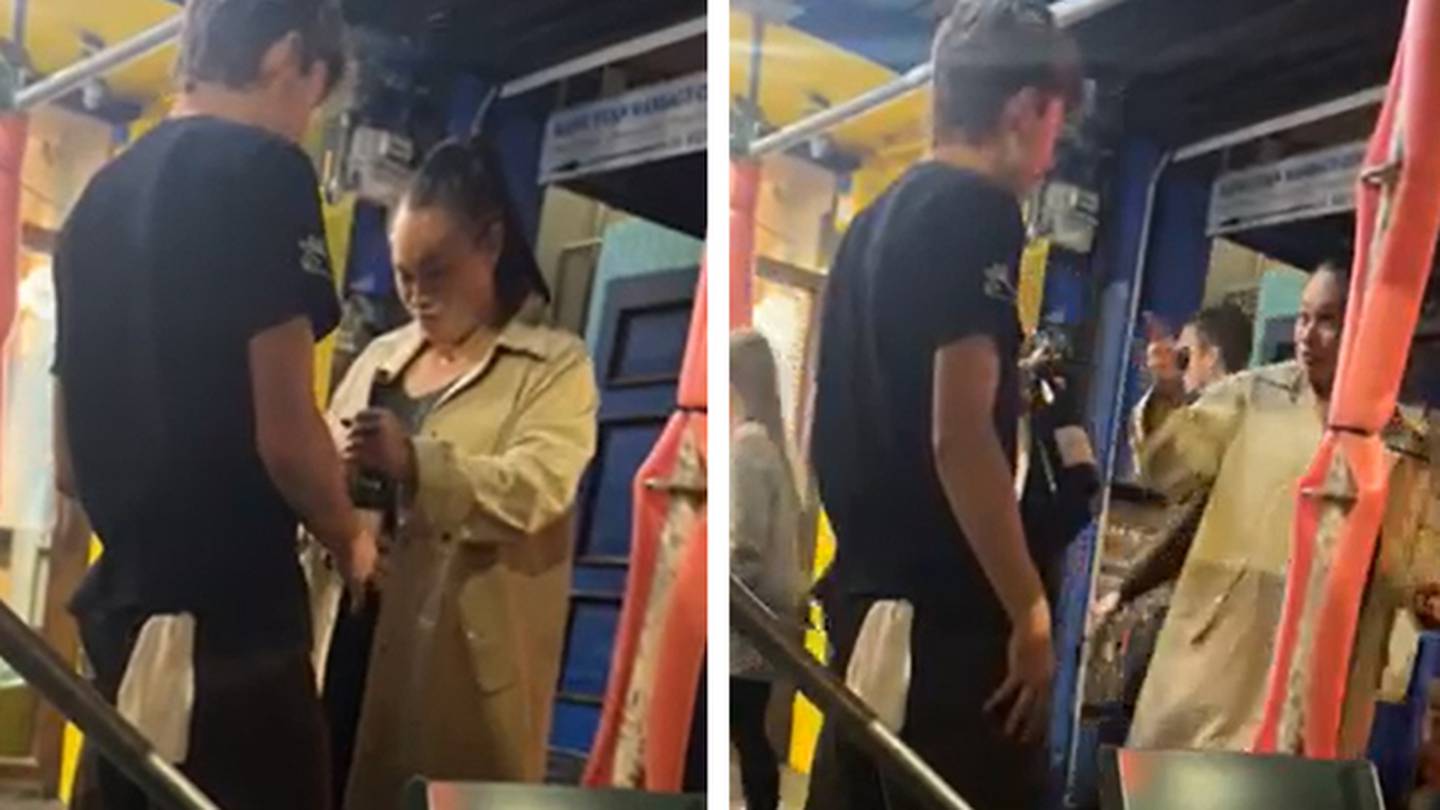 Wellington Mayor Tory Whanau holding a bottle of wine, in discussion with a waiter, outside The Old Quarter on Friday. Photo / Supplied