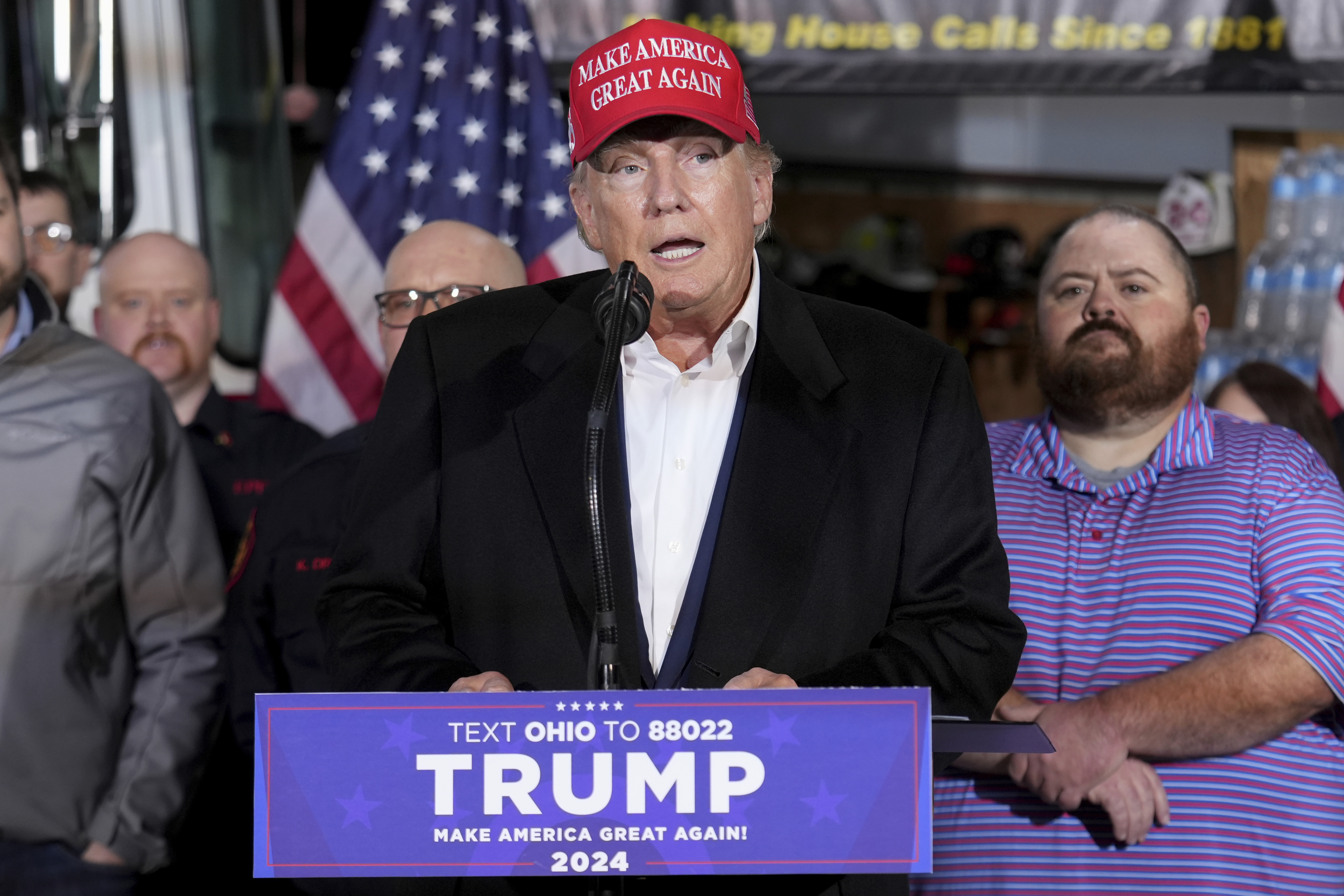 Former President Donald Trump speaks at the East Palestine Fire Department as he visits the area in the aftermath of the Norfolk Southern train derailment. Photo / AP