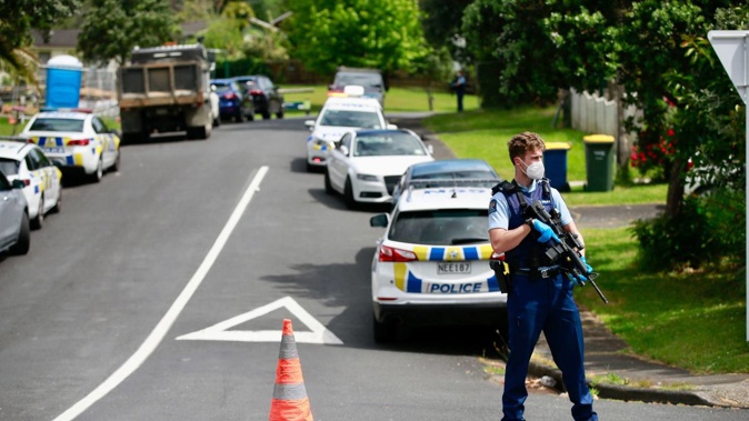 Armed police at the scene in Glen Eden, West Auckland. Photo / Alex Burton