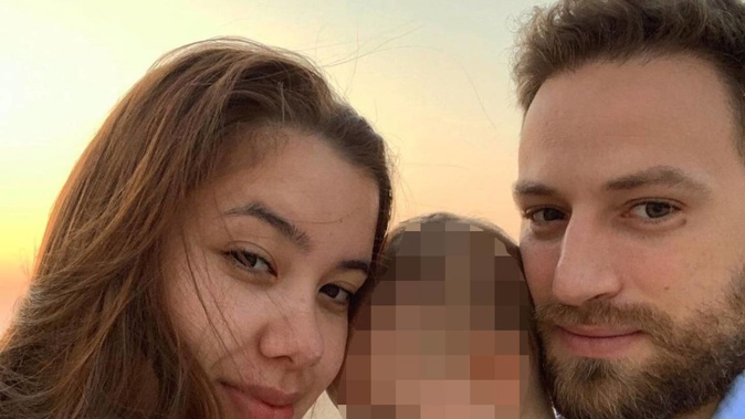 Caroline Crouch and her husband Charalambos Anagnostopoulos pose with their child in a photo posted to social media. (Photo / Instagram)