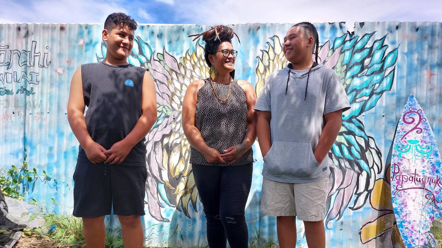 Taiatini Lepaio in the centre, with her son Deejay Rewita-Kaitai, right, and his friend Apiata Patena, left, in front of art in their maara kai. Photo / James Pocock