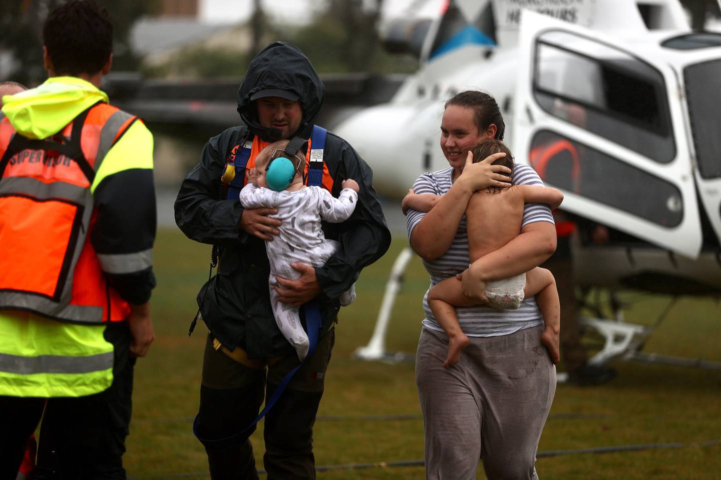 Stranded parents, kids in nappies rescued by chopper as floodwaters rise