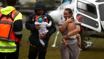 Stranded parents, kids in nappies rescued by chopper as floodwaters rise