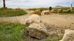 Limestone boulders have been placed to prevent vehicle access on Waimārama Beach. Photo / Warren Buckland.