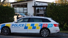 Police at a Beach Haven property where a woman was kidnapped after an altercation on April 2. Photo / Michael Craig