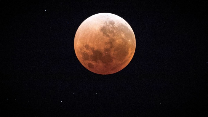 A "blood moon" seen from Auckland in February 2018. A "blood micro-moon" is due in our night skies this Friday. (Photo / Michael Craig)