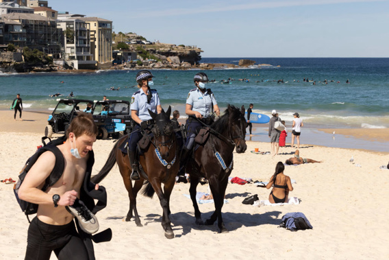 Mounted Police patrol at Bondi Beach as part of public health order compliance operations on August 15 (Photo/Getty)