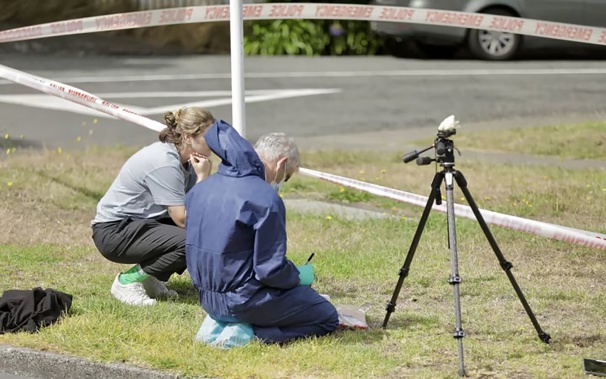 Police forensics staff outside a house on Darlington Rd, Miramar, on March 17. Photo / RNZ