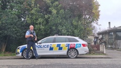 Police with guns at the cordon on Buckingham St, Whakatu. Photo / Michaela Gower 17 July 2025 NZME photographed by Michaela Gower.