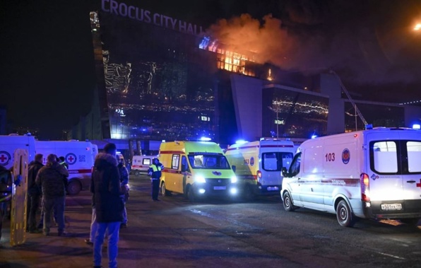 Ambulances parked near the burning building of the Crocus City Hall on the western edge of Moscow. Photo / AP