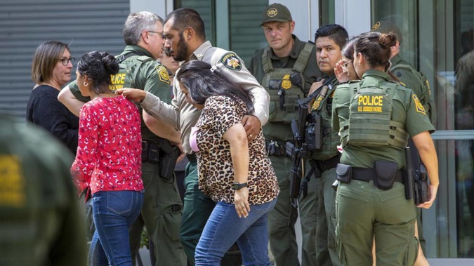 People leave the Uvalde Civic Center following a shooting earlier in the day at Robb Elementary School. Photo / AP