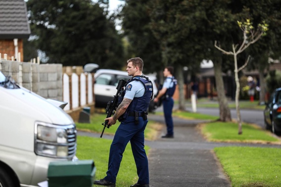 Armed police at the scene of a suspected hit and run incident on Thomas Road Mangere. (Photo / NZ Herald)