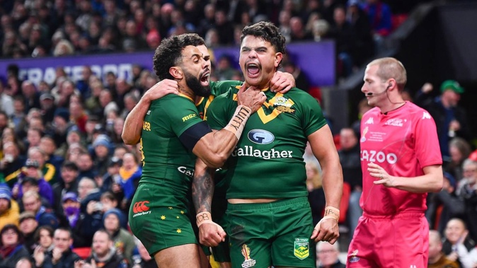 Latrell Mitchell of Australia celebrates scoring during the 2021 Rugby League World Cup final. Photosport