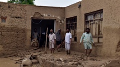 People clean up their damaged homes after heavy flooding in Baghlan province in northern Afghanistan on May 11. Photo / AP