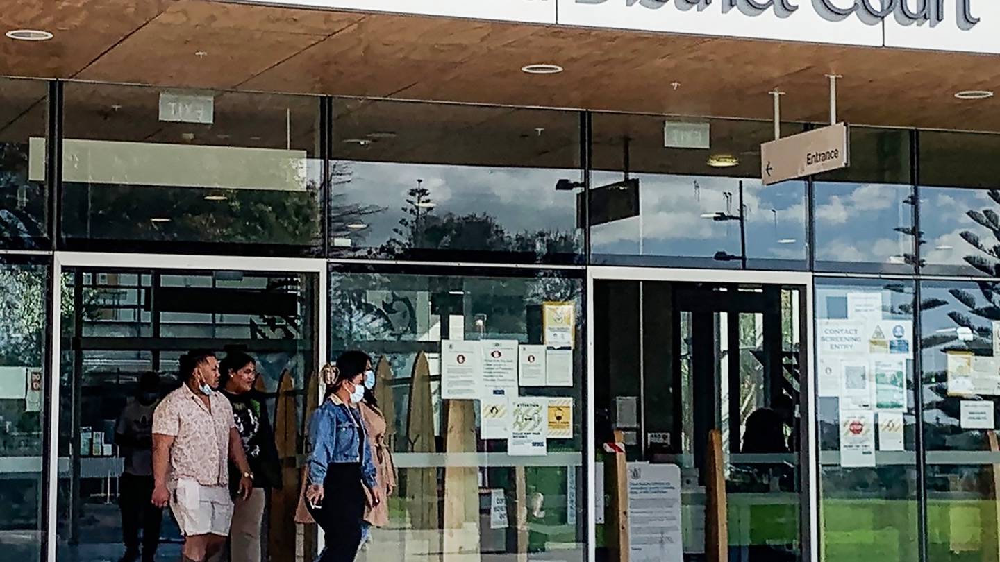 Eunice Foaga (right hidden from view by her sister) leaves the Manukau District Court after entering a not guilty plea. Photo / Ellen Thompson