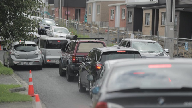 Bumper-to-bumper traffic in West Auckland as thousands gather to celebrate Waitangi Day. Photo / Michael Craig
