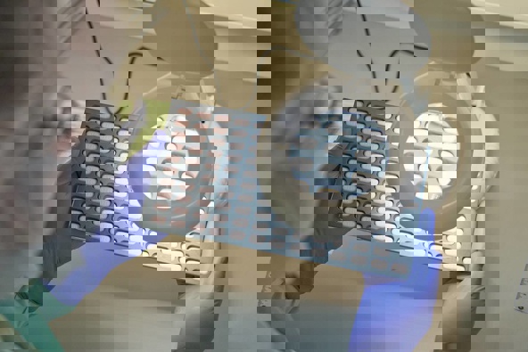 A Phizer lab technician inspects Paxlovid tablet samples in Freiburg, Germany in December. The antiviral pills are soon to be available in New Zealand. (Photo / Pfizer via AP)