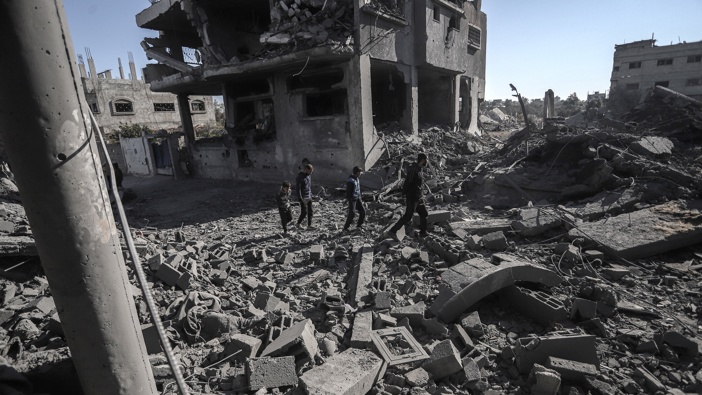 Palestinians inspect the damage following an Israeli airstrike at the Nuseirat refugee camp in central Gaza, on Friday, Jan. 3, 2025. Israeli Prime Minister Benjamin Netanyahu has authorized a delegation to travel to Qatar for discussions on a ceasefire with Hamas in Gaza. Photographer: Ahmad Salem/Bloomberg via Getty Images