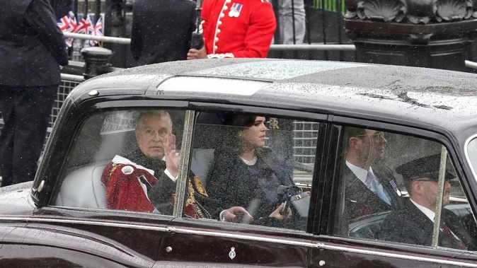 Prince Andrew and Princess Eugenie travel along The Mall ahead of the coronation ceremony of King Charles III in central London. Photo / AP