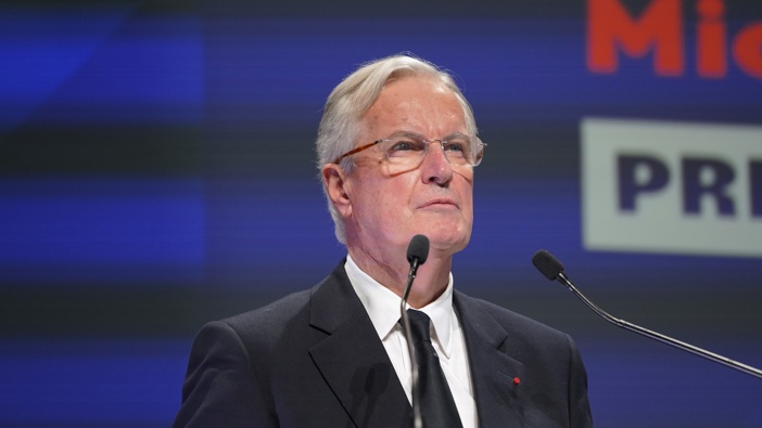 French Prime Minister Michel Barnier addresses a crowd at Impact PME, a gathering of small and medium size businesses on November 28, 2024 in Paris, France. The French prime minister is facing a vote of non-confidence in parliament, potentially creating political paralysis, as he is trying to pass a budget to reduce France's public debt by 60 Billion euros to restore trust to its creditors. (Photo by Remon Haazen/Getty Images)