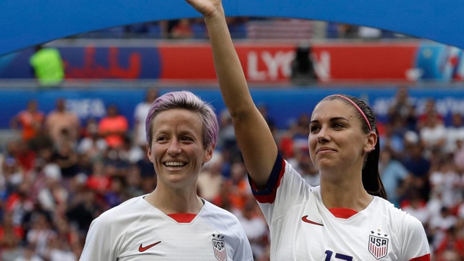 United States' Megan Rapinoe, left, and her teammate Alex Morgan, right, react after winning the Women's World Cup final. (Photo / AP)