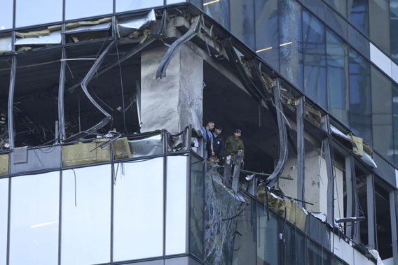 Investigators examine a damaged skyscraper in the "Moscow City" business district after a reported drone attack in Moscow, Russia, early Sunday, July 30, 2023. Photo / AP