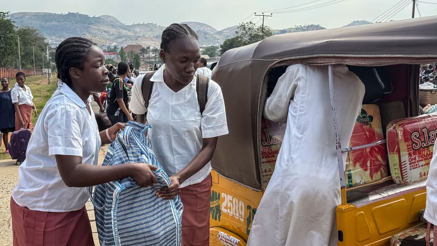 Students load bags into a tuk-tuk outside the Federal Government Girls College in Bwari, on the outskirts of Abuja, on November 22. The national Education Ministry has ordered 47 boarding secondary schools across Nigeria to be shut after gunmen have kidnapped more than 300 students and teachers. Photo / John Okunyomih, AFP
