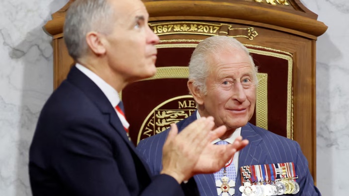 Canada's Prime Minister Mark Carney claps after Britain's King Charles III delivered the Speech from the Throne during the opening the first session of the 45th Parliament of Canada at the Senate of Canada in Ottawa. Photo / AFP