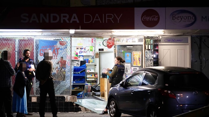 Police outside the Sandra Dairy, in Ellerslie, after a ram-raid last year. Photo / Hayden Woodward