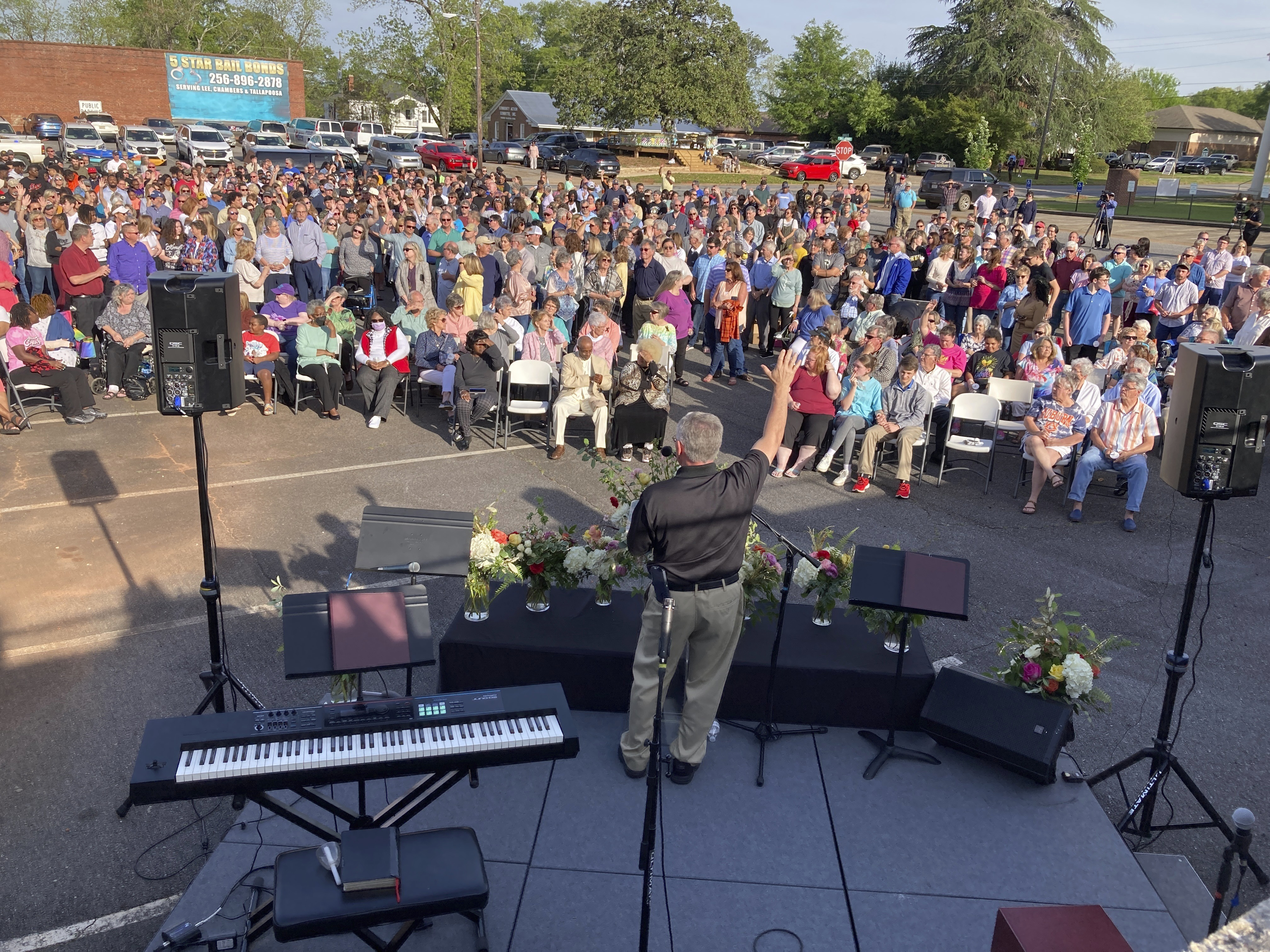A pastor prays for shooting victims in Dadeville, Ala., at a vigil in the parking lot of First Baptist Church, Sunday, April 16, 2023. Photo / AP