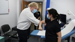 Britain's Prime Minister Boris Johnson greets staff during a visit to Finchley Memorial Hospital in North London. (Photo / AP)