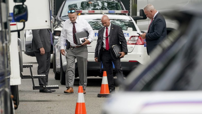 Authorities search the home of suspect Rex Heuermann, Tuesday, July 18 in Massapequa Park. As new details emerge about how police finally caught the alleged Gilgo Beach serial killer, they've also raised questions about whether investigators adequately pursued a key lead that may have helped solve the case sooner. Photo / AP