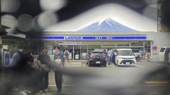 Officials in Japan are working to fix holes in a screen designed to discourage snap-happy visitors. Photo / AP
