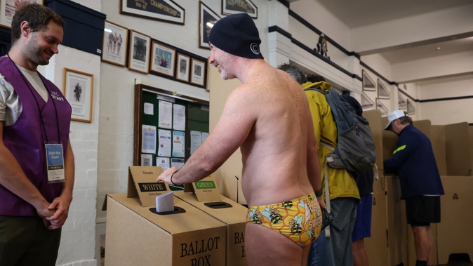 A voter casts his ballot in Australia's general election at a polling station at the Bondi Surf Bathers Life Saving Club in Sydney. Photo / AFP