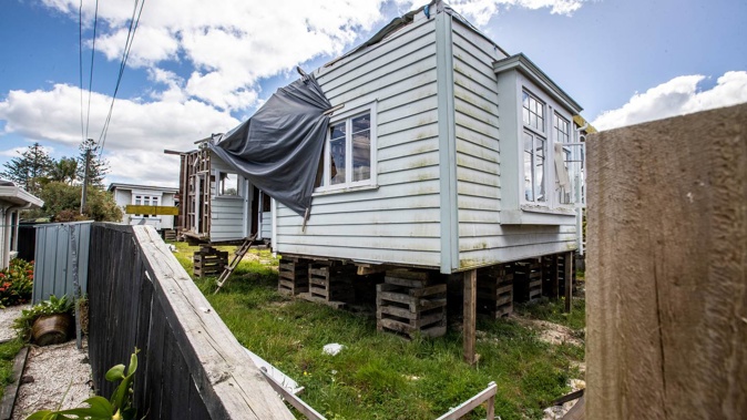 The homes are raised on wooden pallets and sitting in a state of disrepair. Photo / Michael Craig