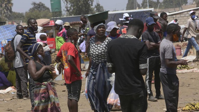 People attend a busy market in a poor township on the outskirts of the capital Harare on Monday, November 15, 2021. (Photo / AP)