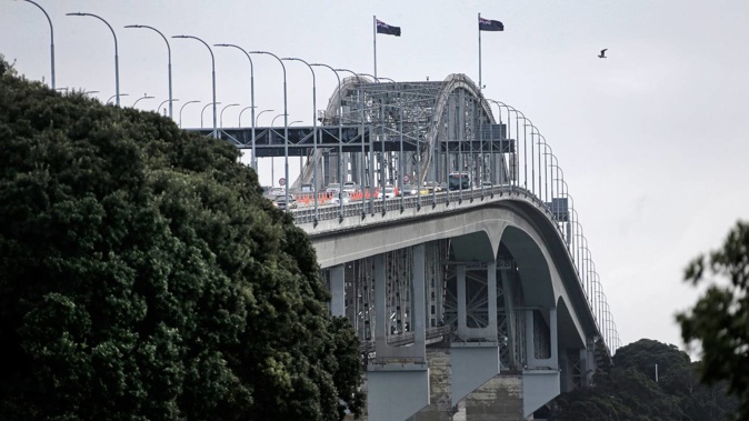 The Auckland Harbour Bridge is on a high wind alert, with strong gusts threatening to lower speed limits and close lanes this afternoon. Photo / File, Alex Burton