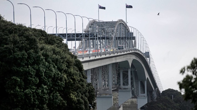 The Auckland Harbour Bridge is on a high wind alert, with strong gusts threatening to lower speed limits and close lanes this afternoon. Photo / File, Alex Burton
