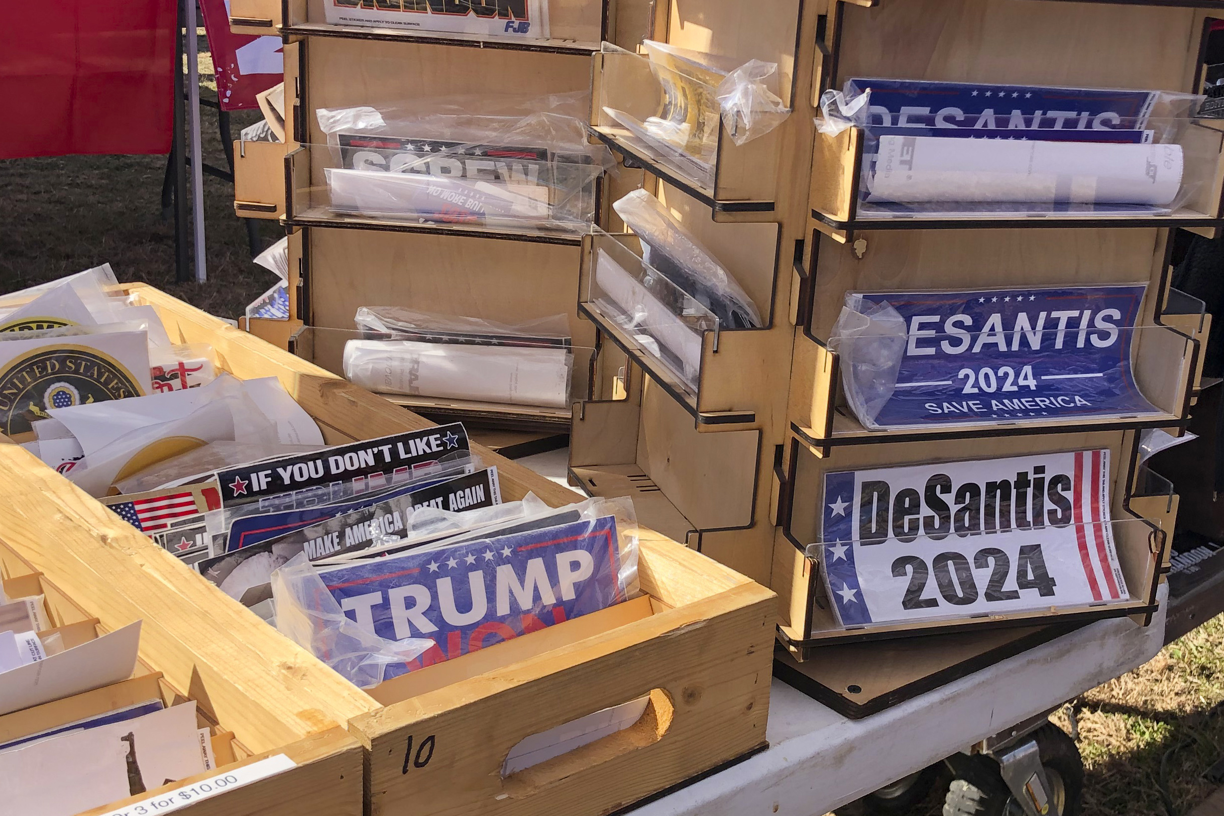Bumper stickers supporting Florida Gov. Ron DeSantis on sale at former President Donald Trump's rally in Conroe, Texas, Jan. 29, 2022. Photo / AP