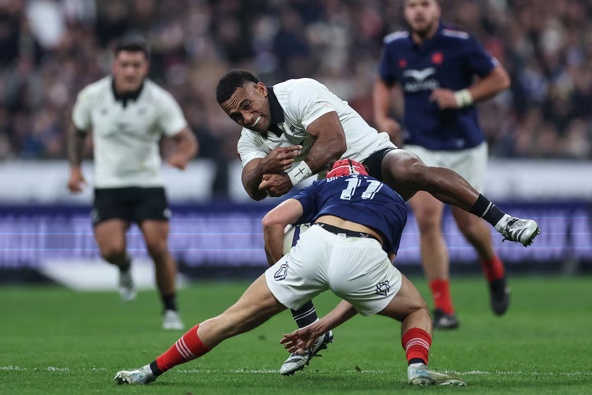 All Blacks wing Sevu Reece is tackled by France's left wing Louis Bielle-Biarrey during the test at Stade de France in Paris. Photo / AFP