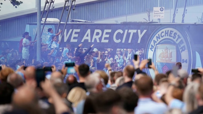 Fans welcome Manchester City players before the start of an English Premier League match at the Etihad Stadium. Photo / AP