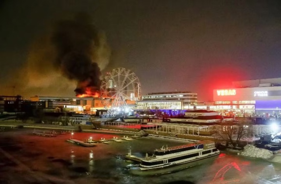 A massive blaze is seen over the Crocus City Hall on the western edge of Moscow. Photo / AP